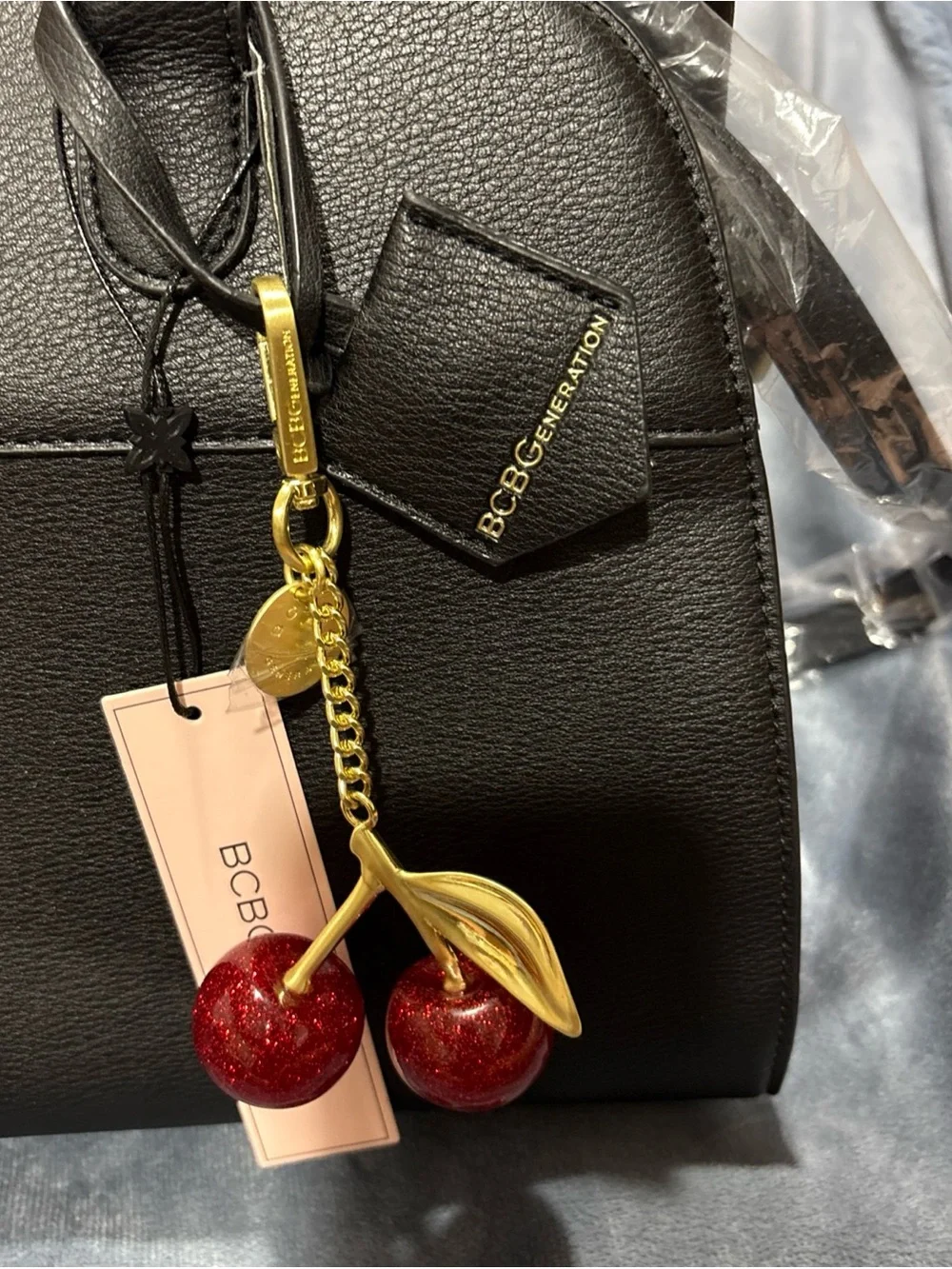 BCBGeneration Black Faux Leather Satchel with Red Cherry Charm